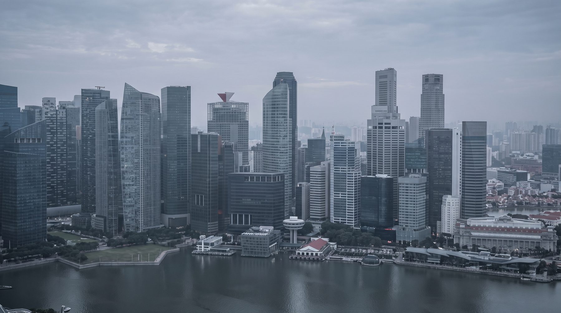 Singapore skyline along Marina Bay in the evening